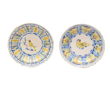 Pair of Continental faience dishes, circa 1900, each decorated with a perching bird within panelled border, initialled beneat