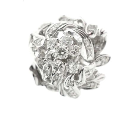 Diamond multi-stone dress ring in the form of a flower, having a cluster to the centre, the shank stamped '18K', size R appro