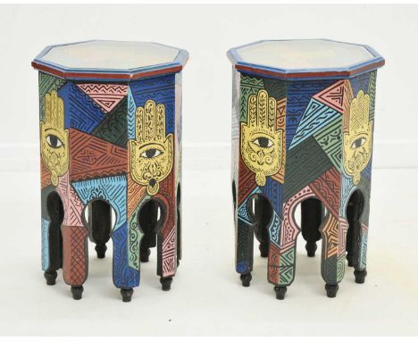 Pair of Moroccan painted octagonal side tables or lamp stands, having glass-inset tops, with brightly coloured decoration of 