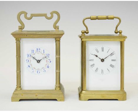 Two brass carriage clocks, circa 1900, the first with blue Arabic chapters and floral swags, striking on a coiled gong in a f