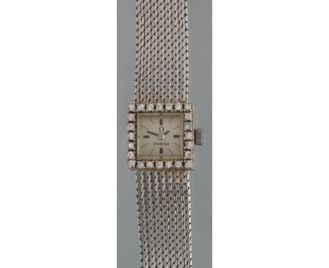 18CT ART DECO DESIGN WHITE GOLD DIAMOND SET LADIES BRACELET COCKTAIL WATCH having square satin face with baton numerals, mesh