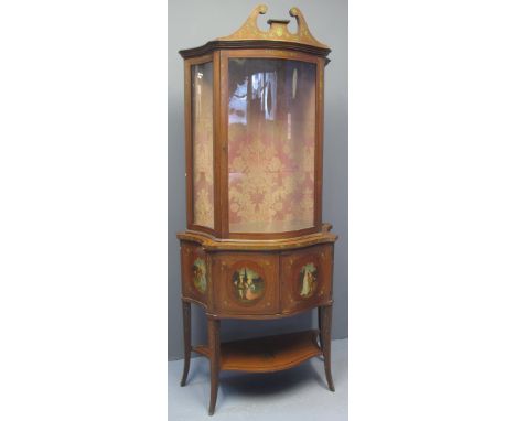 VICTORIAN PAINTED MAHOGANY SERPENTINE FRONTED DISPLAY CABINET having broken swan neck pediment above single serpentine door, 