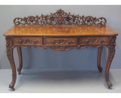 20TH CENTURY VICTORIAN STYLE WALNUT SIDE TABLE, having raised and pierced scrollwork back, serpentine front over three cock b