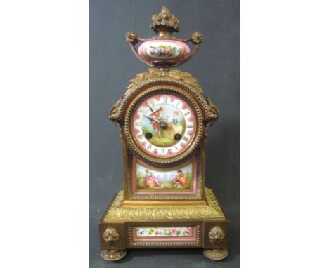 19TH CENTURY FRENCH PORCELAIN MOUNTED ORMOLU MANTEL CLOCK the arched case surmounted by porcelain and ormolu vase shaped fini