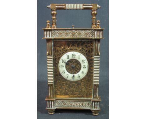 LARGE FRENCH BRASS CARRIAGE CLOCK having ornate gorge type case with fluted pilasters and finials, folding handle, circular p