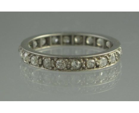 A PLATINUM AND DIAMOND FULL ETERNITY RING. Ring size O. Weight 3.2g approx. (B.P. 24% incl. VAT) CONDITION REPORT: Stamped 'P