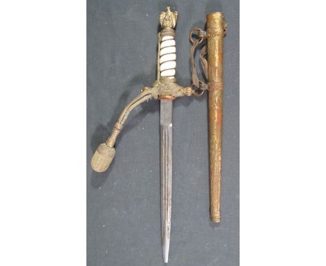 GERMAN NAZI NAVAL OFFICER'S DRESS DAGGER having eagle on Swastika pommel above wire bound ivory coloured grip, braided cord m