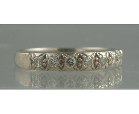 AN 18CT WHITE GOLD AND DIAMOND HALF ETERNITY STYLE RING. Ring size X. Weight 4.9g approx. (B.P. 24% incl. VAT) CONDITION REPO