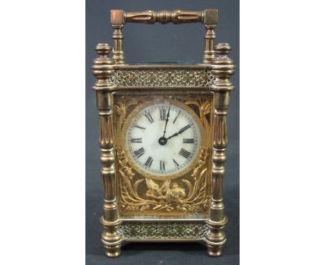 PRETTY 19TH CENTURY FRENCH BRASS CARRIAGE CLOCK having ornate gorge type case with baluster corner pillars, fixed handle and 