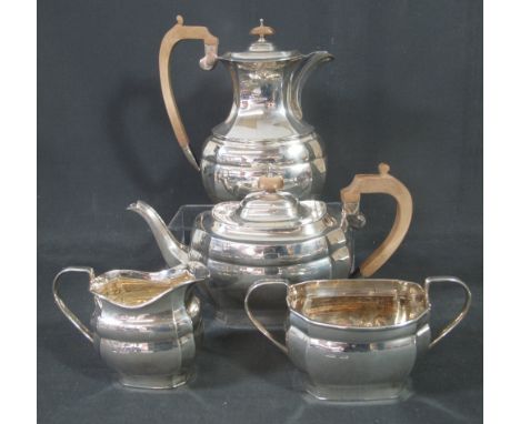 GEORGE V SILVER FOUR PIECE TEA AND COFFEE SERVICE to include; teapot, coffee pot, cream jug and two handled sucrier. H. Fishe
