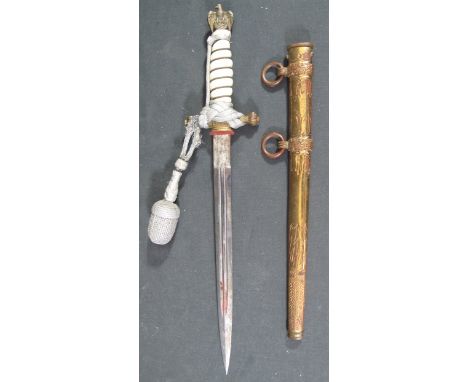 GERMAN NAZI NAVAL OFFICER'S DRESS DAGGER having eagle and Swastika pommel above ivory coloured wire bound grip, unmarked doub