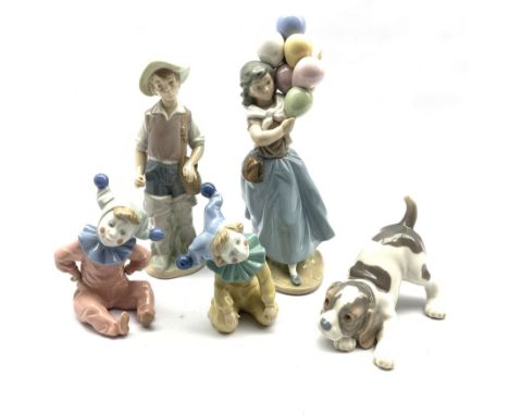 Three Lladro figures comprising The Balloon Seller, Gone Fishing and Playful Puppy and two Nao Clowns (5) - Condition Report 