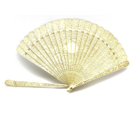 19th century Chinese Canton carved ivory brise fan: each pierced stick intricately carved on one side with a continuous scene