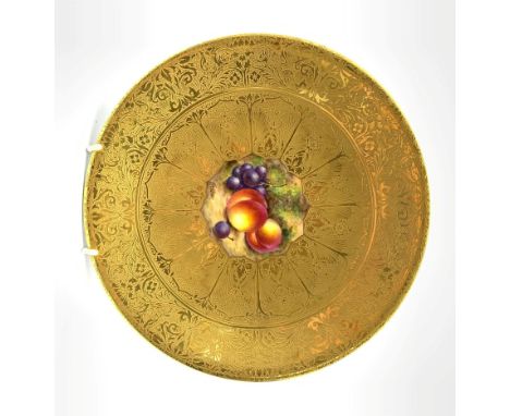 Royal Worcester cabinet plate painted with a centre panel of peaches and grapes within a tooled and etched gilded ground sign
