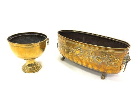 Embossed brass oval planter with lion mask handles and claw and ball feet L64cm and a brass pedestal bowl H29cm - Condition R