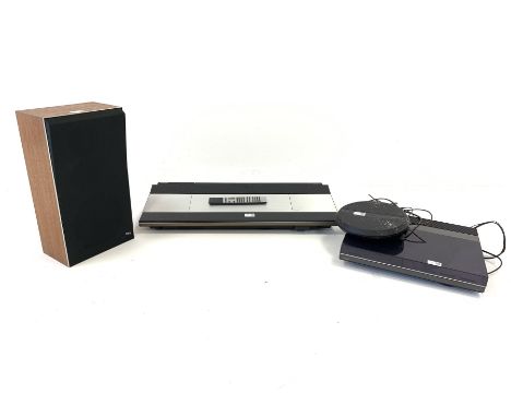 Bang and Olufsen Beocenter 9000 with remote control,  Bang and Olufsen  Beogram TX2 turntable, one Beovox S40 speaker and an 