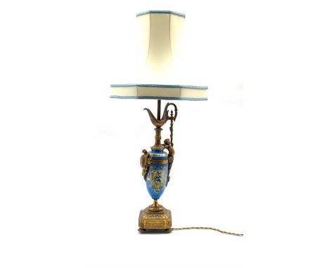 Continental Porcelain table lamp in the form of a ewer decorated with figure panel on a blue ground with gilt metal mounts H5