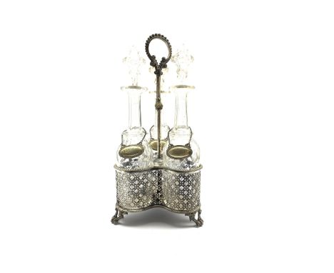 Plated three division decanter stand with loop handle, pierced sides and fitted with three glass decanters with plated labels