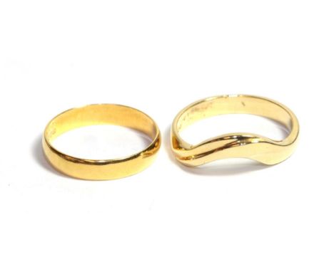 A 22 carat gold band ring, finger size K' and an 18 carat gold shaped ring, finger size M (2).  22 carat gold band ring - 1.9