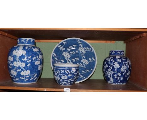 Two large 20th century Chinese blue and white prunus ginger jars and covers, together with a similar charger and planter
