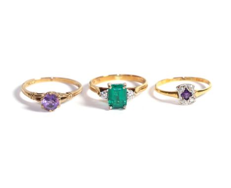 An amethyst and diamond ring cluster ring, stamped '18CT', finger size L1/2; a 9 carat gold amethyst solitaire ring, finger s