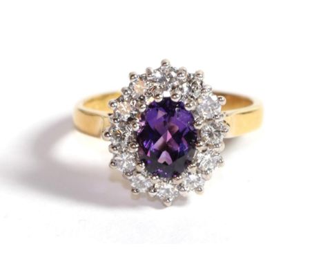 An 18 carat gold amethyst and diamond ring, finger size L.  Gross weight - 5.7 grams. 