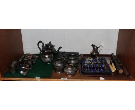 An assortment of silver spoons, a silver cream jug (a.f.), together with an assortment of silver plate hollow and flatware, a