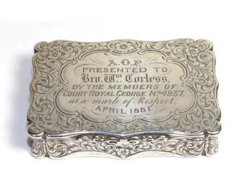 A Victorian silver snuff box, Edward Smith, Birmingham 1858, shaped rectangular with foliate engraving. later presentation in