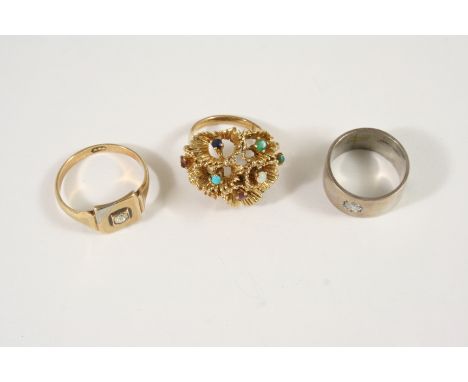 A GOLD AND GEM SET RING 11.8 grams, size K, together with a diamond and gold ring, size V and a silver ring set with a diamon