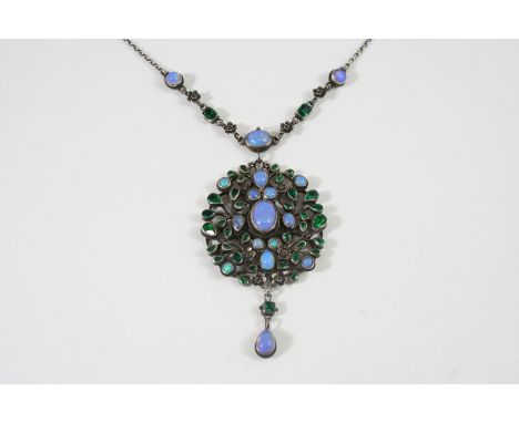 AN ARTS AND CRAFTS PENDANT BY ARTHUR (1862-1928) AND GEORGIE GASKIN (1866-1934) the silver openwork foliate pendant is mounte