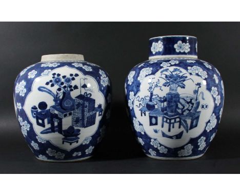 PAIR OF CHINESE BLUE AND WHITE GINGER JARS AND ONE COVER, Kangxi style but later, painted with three cartouches of vases of f