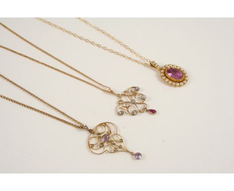 AN EDWARDIAN DIAMOND AND RUBY PENDANT the 15ct. gold openwork design is mounted with rose-cut diamonds and suspends a ruby pe