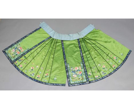 CHINESE SILK AND EMBROIDERED SKIRT, late 19th or early 20th century, the apple green ground worked with chrysanthemum and oth