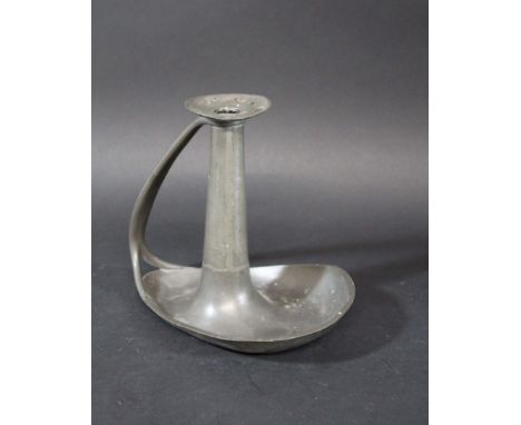 LIBERTY TUDRIC CHAMBER STICK a pewter chamberstick with a flared base and curved handle. Impressed marks, Tudric 2480. 6 3/4i