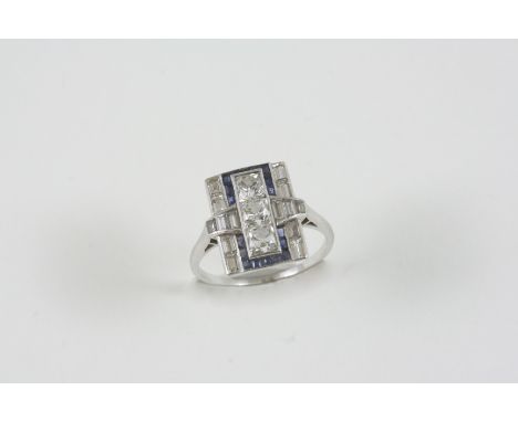 AN ART DECO SAPPHIRE AND DIAMOND RING the plaque ring is centred with three square-shaped old brilliant-cut diamonds within a