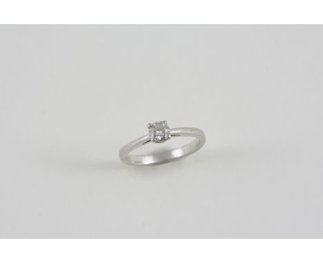 A DIAMOND SOLITAIRE RING set with a round brilliant-cut diamond, in platinum. Size K. Accompanied by report number F3C89869 f