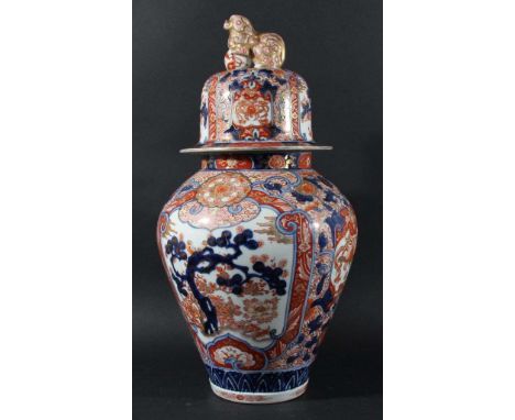 CHINESE IMARI VASE AND COVER, of inverted baluster form, with Guardian Lion finial, with hardwood stand, height 55cm (2)