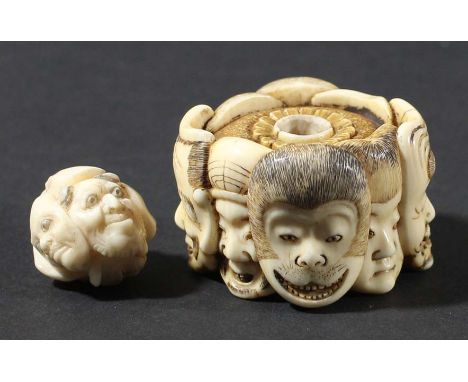 JAPANESE IVORY NETSUKE, 19th century, carved with eight masks including a monkey, eagle and human faces, diameter 4cm; togeth