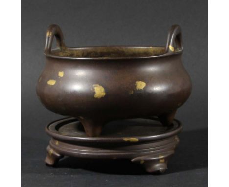 CHINESE BRONZE AND GOLD SPLASH CENSER AND STAND, Xuande mark but later, of circular, two handled, tripod form, the stand of c