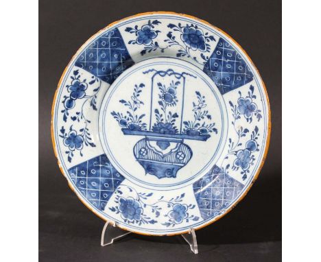 DUTCH DELFT BLUE AND WHITE PLATE, Het Bijltje, 18th century, painted with a central floral panel inside an ochre rim, blue pa