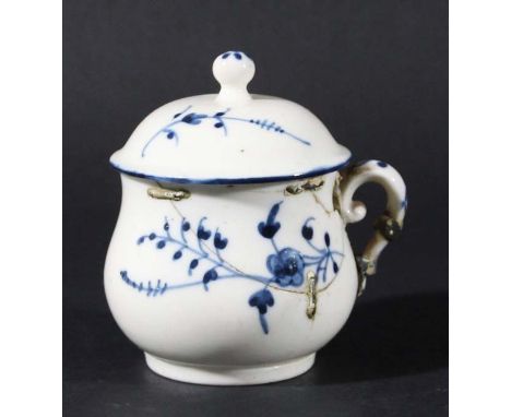CHANTILLY CUSTARD CUP AND COVER, circa 1750, blue painted with trailing flowers and leaves, the domed cover with ball finial,