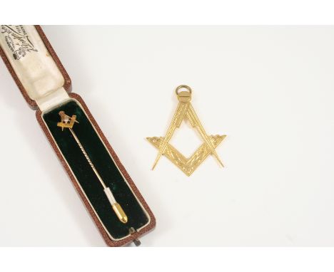 AN 18CT. GOLD MASONIC PENDANT 5cm. high, 7.6 grams, together with a 15ct. gold Masonic stick pin, centred with a small diamon