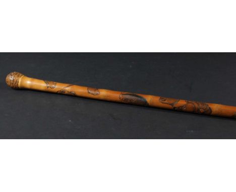 JAPANESE CARVED BAMBOO HIKING STICK, carved with various fish, octopus and other sea creatures, with a metal spike, height 90