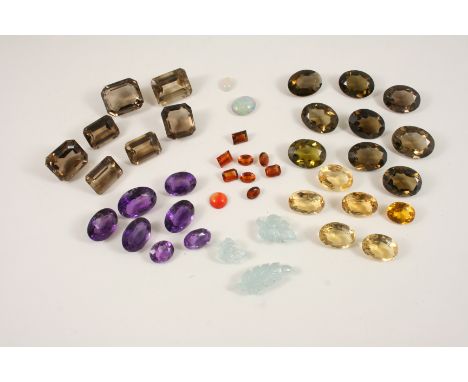 A QUANTITY OF LOOSE GEM STONES including citrine, amethyst, smoky quartz, and opal.