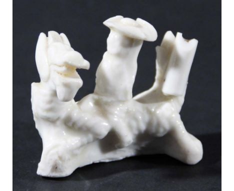 CHINESE BLANC DE CHINE GROUP, 17th century, depicting a Dutchman in a tricorn hat riding a dragon, perhaps originally a whist
