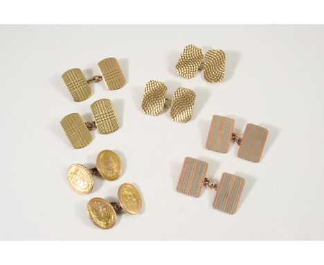 A PAIR OF 9CT. TWO COLOUR GOLD CUFFLINKS of rectangular shape, with engine turned decoration, 8.9 grams, together with three 