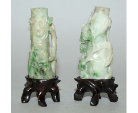 A GOOD PAIR OF EARLY 20TH CENTURY CHINESE MINIATURE JADE VASES, together with fitted wood stands, each of bamboo form enshrou