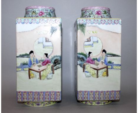 A PAIR OF 20TH CENTURY CHINESE FAMILLE ROSE PORCELAIN CONG VASES, the sides painted with a continuous scene of ladies in a ga