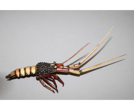 AN EARLY 20TH CENTURY SIGNED JAPANESE ARTICULATED IVORY MODEL OF A CRAYFISH, the details stained and engraved, 8in long overa