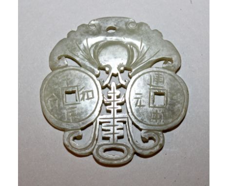 AN EARLY 20TH CENTURY CHINESE CELADON JADE PENDANT, carved and pierced with a butterfly, a Shou symbol and two pieces of ‘cas